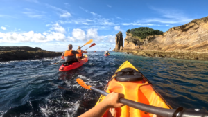Kayaking along volcanic coastline in São Miguel Azores